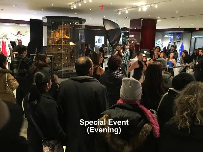 Crowd gathered around the castle during an evening special event