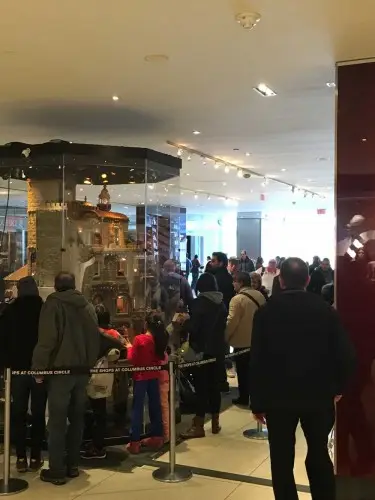 Visitors queueing to view the castle in its glass case